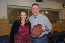 Potter Roberta Green with raffle winner of her ceramic piece